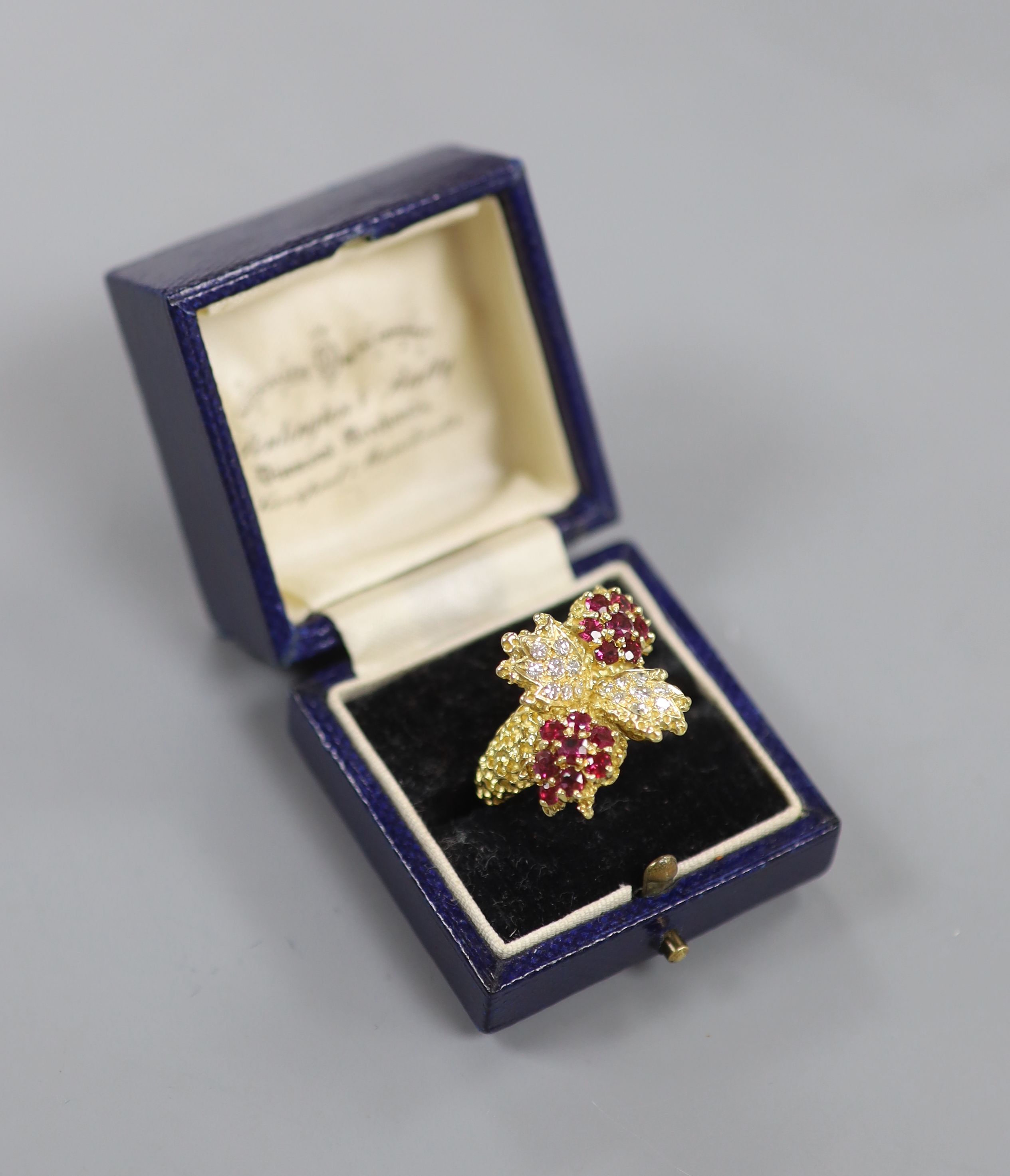 A 1970's 18ct gold, ruby and diamond quadruple cluster dress ring, by Ben Rosenfeld